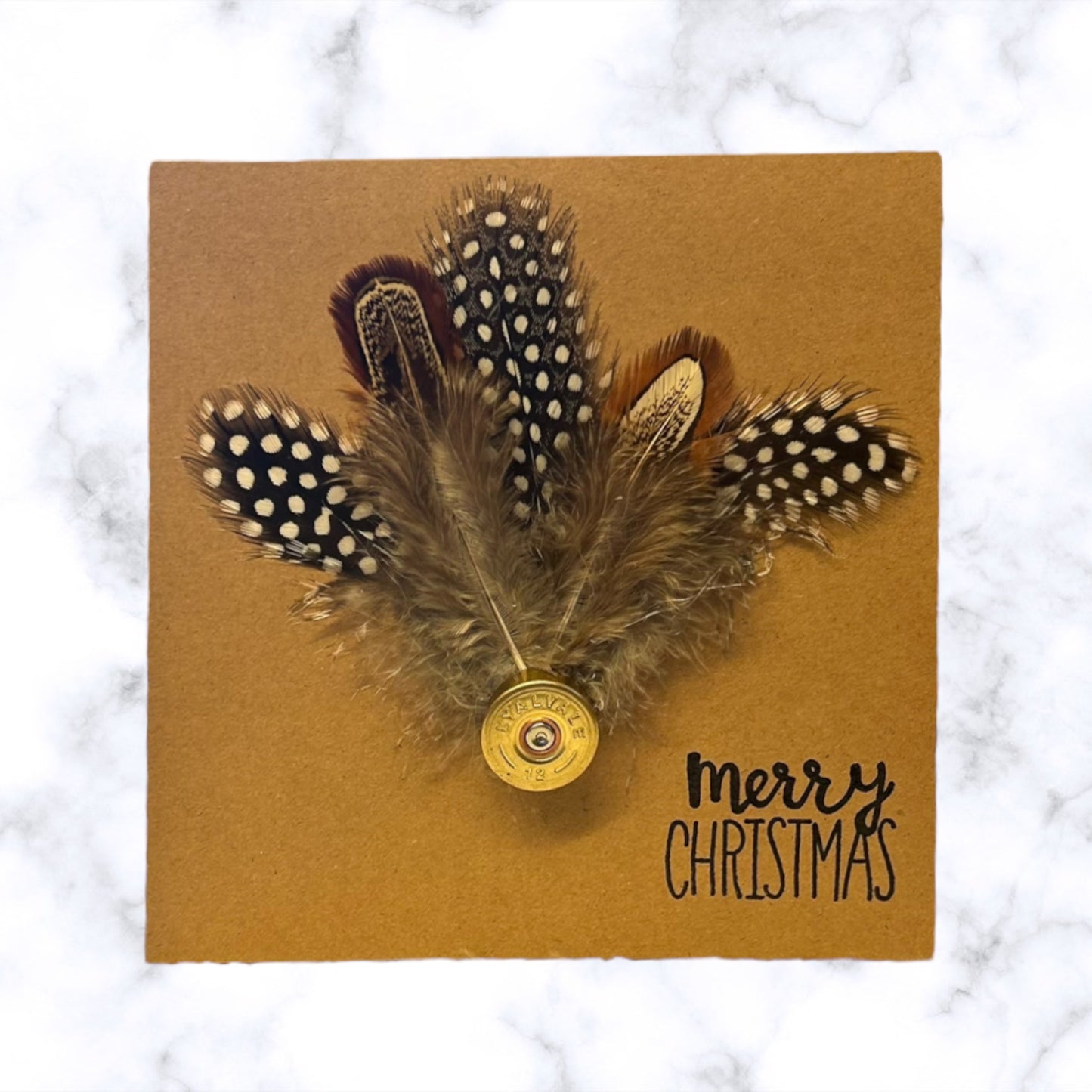 Christmas card with natural feathers and shotgun cartridge
