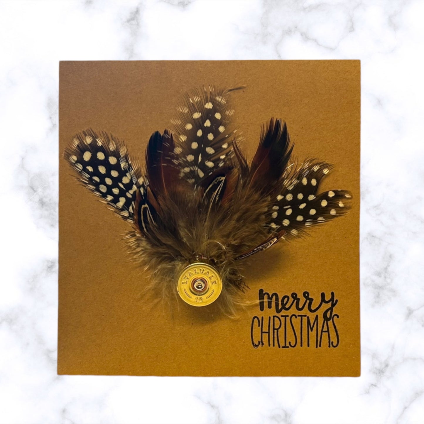 Christmas card with natural feathers and shotgun cartridge